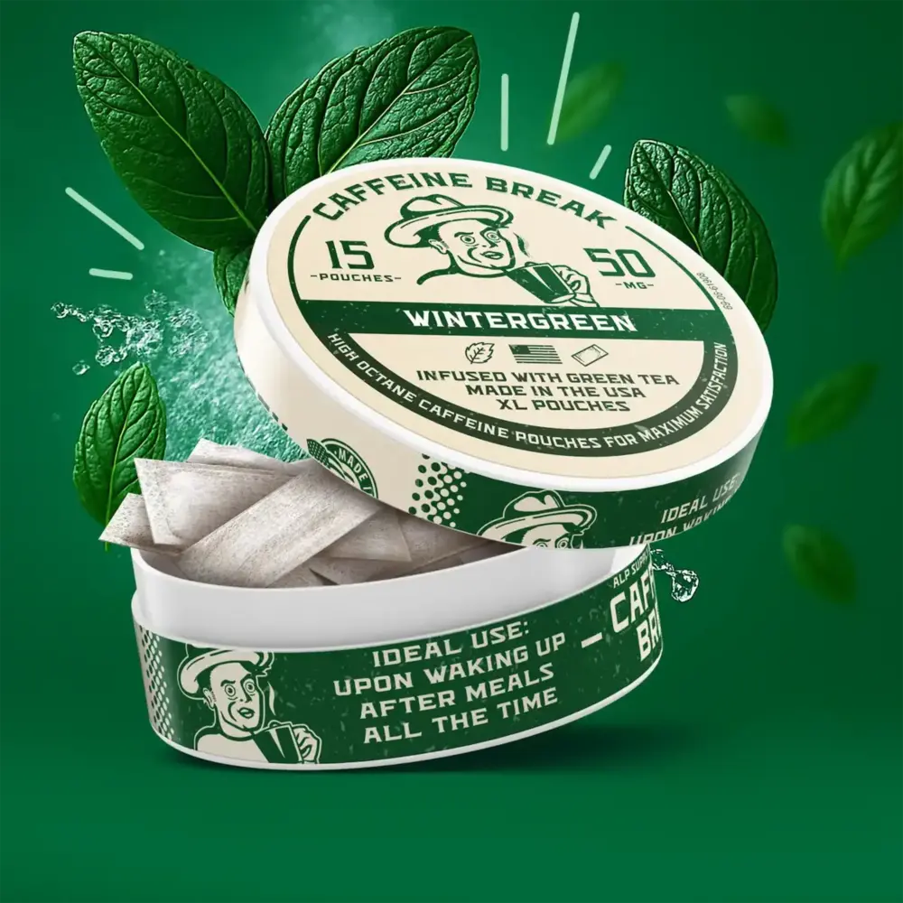 Wintergreen caffeine pouches tin with 15 pouches and 50mg caffeine, surrounded by green mint leaves